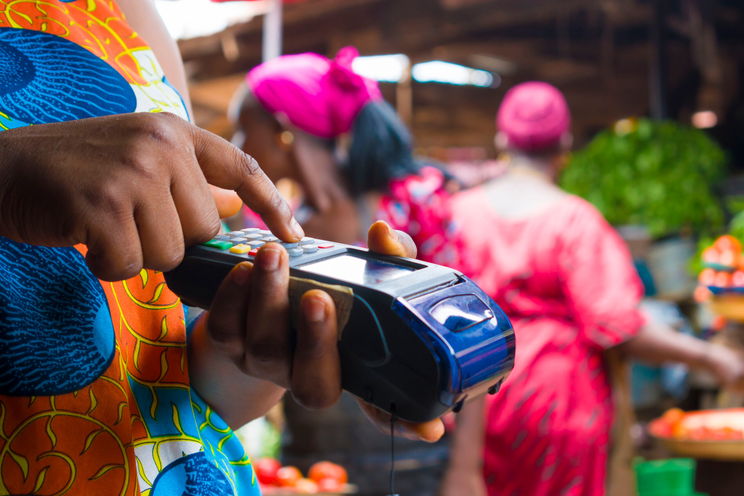 African,Woman,Trying,To,Operate,A,Pos,Machine,In,The